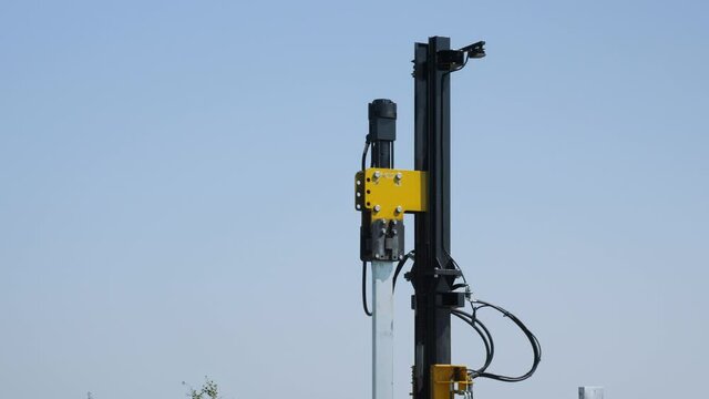 Renewable energy solar farm construction pile driver