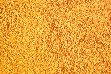 rough orange wall surface with irregularities