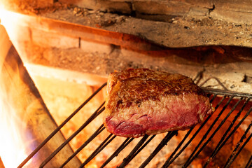 Beautiful piece of beef fillet on a coal grill