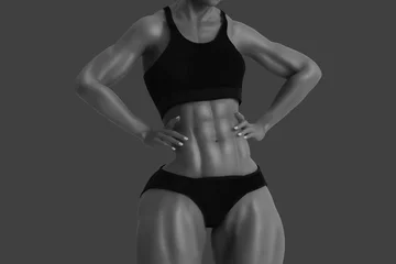 Abwaschbare Fototapete Strong muscular female body © PixlMakr