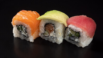 three types of rolls on a black surface