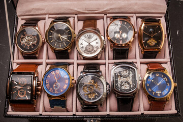 storage box with collection of men wrist watches