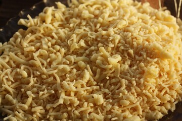 Fresh grated cheese on a plate macro