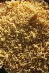 Fresh grated cheese on a plate macro
