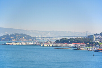Fototapeta na wymiar Looking at the Fisherman's Wharf with the San Francisco Oakland Bay Bridge in the background