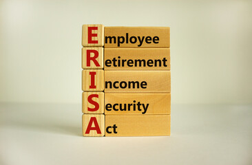Wooden blocks and cubes with words 'ERISA - employee retirement income security act'. Beautiful...