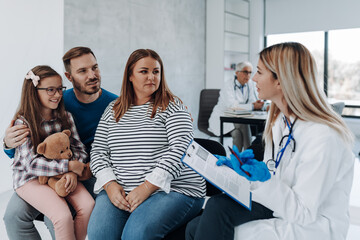 Health counseling. The family is consulting with doctor about the problem they have.