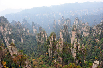 Zhangjiajie, Hunan, China - Dec 2011: Tourists and travelers marvel at the natural wonders of...