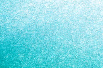 foam blue texture soap bubbles on the water abstract background