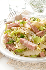 Pasta with ham under bechamel sauce