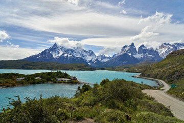 Naklejka na ściany i meble Cuernos, Horns of torres del paine covered with snow, torres del paine national park in the Andes, southern Chile, south America, towering over the turquoise water of lake Pehoe with dramatic clouds