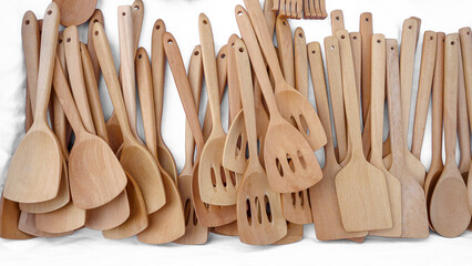 Various wooden ladle designs on white background.                            