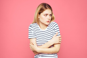 Woman in striped t-shirt emotions studio cropped view lifestyle pink isolated background