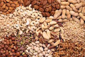 Assortment of various nuts such as cashew nuts, brazil nuts, peanuts, almonds, pecan and other, top view


