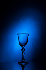 
Glass shot glass on blue gradient background