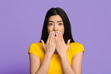 OMG. Shocked Asian Female Covering Mouth With Hands, Looking At Camera