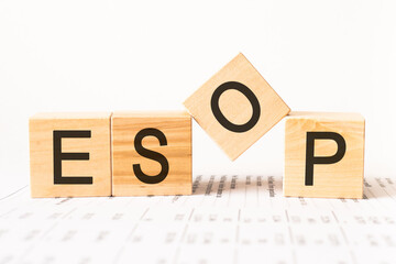 Word esop. Wooden small cubes with letters isolated on white background with copy space available