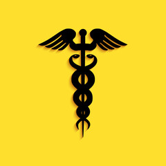 Black Caduceus medical symbol icon isolated on yellow background. Medicine and health care concept. Emblem for drugstore or medicine, pharmacy snake. Long shadow style. Vector.