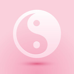 Paper cut Yin Yang symbol of harmony and balance icon isolated on pink background. Paper art style. Vector.