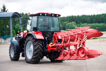 farm tractor with plow on the farm