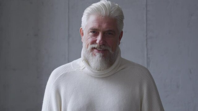 Portrait of handsome senior man with gray beard.