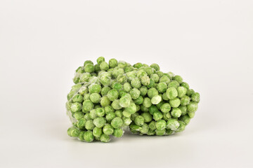 frozen peas isolated on white background