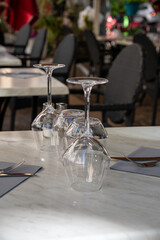 Before lunch time, empty stylish cafes with served tables waiting for guests in Saint-Tropez, Provence, France