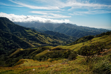 Obraz premium Landscape from Monte Verde in Costa Rica, mountains and green forests, rainforest and bue sky with the clouds
