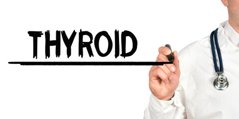 Doctor writes the word - THYROID. Image of a hand holding a marker isolated on a white background.