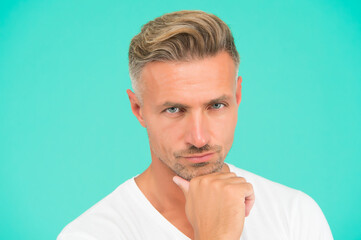 Naklejka premium Personal care. serious well groomed guy. handsome male has perfect skin on his face. new dye haircut. graying hair coloring at hairdresser. mens beauty and health. portrait of mature man