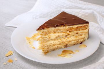 Almond cake. Piece of Cake on a Plate. Sweet food. Sweet dessert. White background.