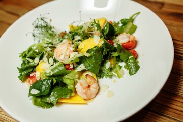 Green salad with shrimps. Healthy seafood meal