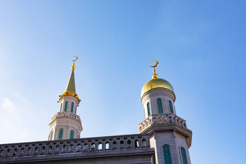 Fototapeta na wymiar Golden Minarets Moscow Cathedral Mosque with months. The largest Muslim religious building in Russia