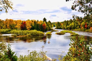 Fototapeta na wymiar Autumn landscape with lake and trees in Michigan Tahquamenon State Park. 