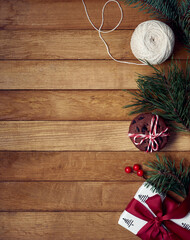 Christmas gifts with christmas decoration on wooden background.