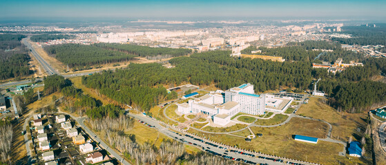 Gomel, Belarus. Aerial View OF Building Of Republican Scientific Center For Radiation Medicine And Human Ecology In Spring Sunny Day. Top View. Drone View. Bird's Eye View. Panorama