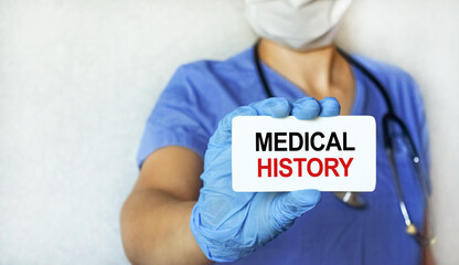 A young girl doctor holds a tablet with an inscription on a medical topic in her hand. Health care...