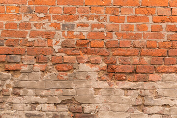 The background of the weathered wall of red brick. Horizontal masonry.