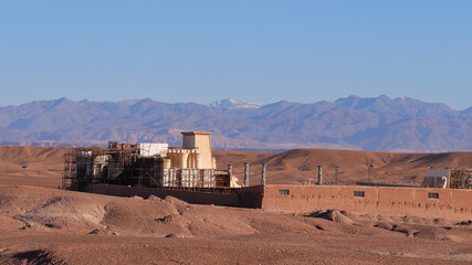 Film set in the desert outside of  Ouarzazate, Morocco, Africa, an important location of the movie industry with several film studios with the foothills of the southern Atlas Mountains in background.