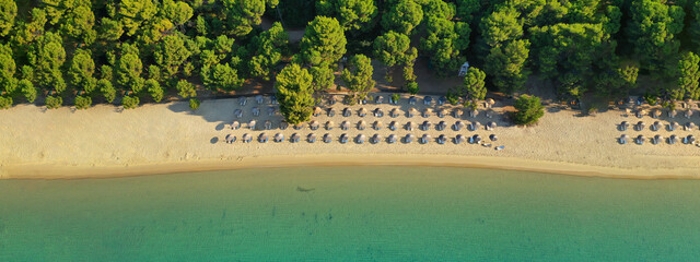 Aerial drone ultra wide panoramic photo of famous sandy beach and bay of Koukounaries a natural...