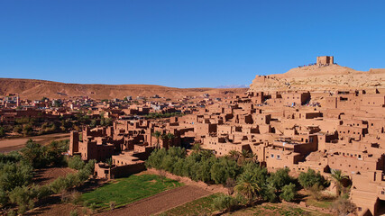 Panorama view of majestic Moorish ksar Ait Benhaddou, UNESCO World Heritage Site, with historic loam buildings located on the foothills of the Atlas Mountains near Ouarzazate, Morocco, Africa.