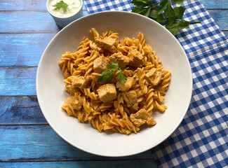 Classic chicken meat goulash with fusilli pasta in sour creme sauce.