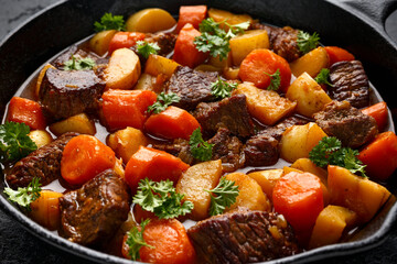 Beef Stew with carrot and baby potato in iron cast pan