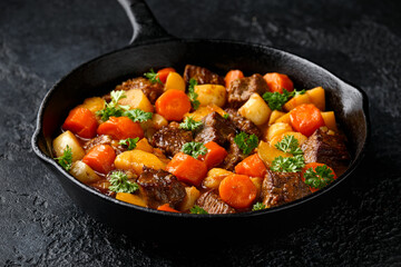 Beef Stew with carrot and baby potato in iron cast pan