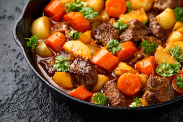 Beef Stew with carrot and baby potato in iron cast pan