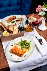 Lasagne bolognese in a plate on a table