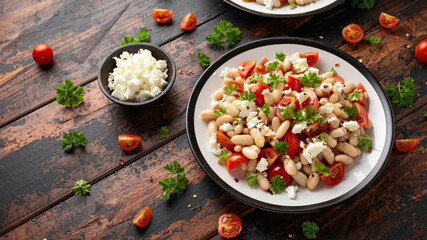 White Bean Salad with Cherry Tomatoes, Feta cheese and parsley. Healthy vegetarian, vegan food