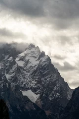 Tuinposter Dark clouds over mountains © Tony Campbell