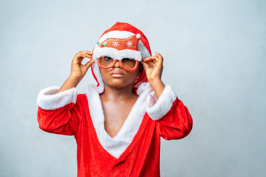 image of african girl, with santa claus costume.