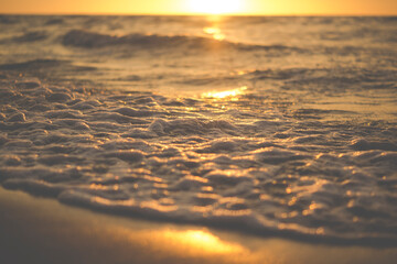 detail of sea waves during sunset